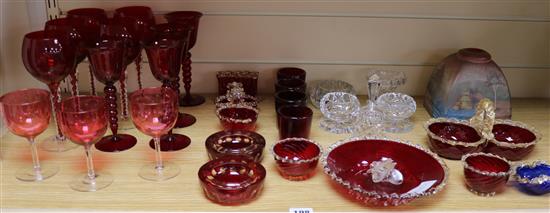 A group of assorted coloured and clear glassware